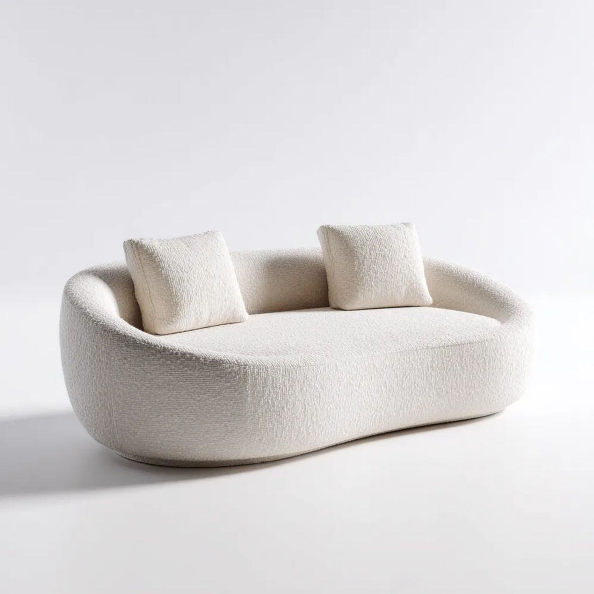 Kremowa sofa dwuosobowa z tkaniny bouclé, owalna, 180 × 90 × 72 cm